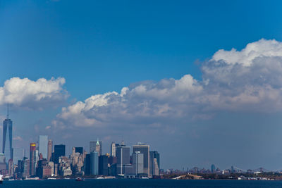 City skyline against blue sky