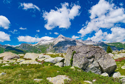 Low angle view of rocky mountains against sky