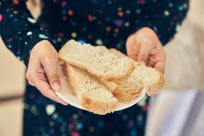 Midsection of woman holding food