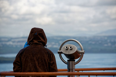 Rear view of person standing at observation point