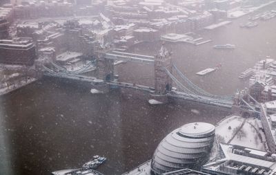 High angle view of snow on city street during winter