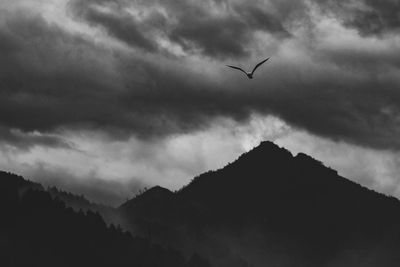Low angle view of silhouette mountain against sky