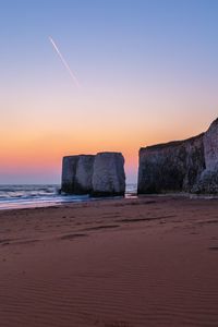 Scenic view of sea at sunset