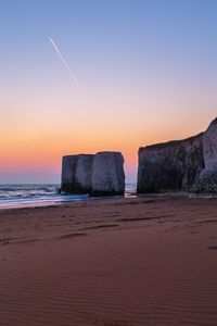 Scenic view of sea at sunset