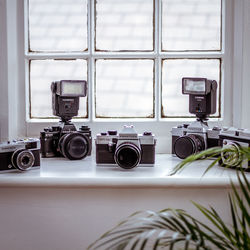 Close-up of camera on window