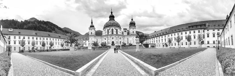 Panoramic view of buildings in city against sky