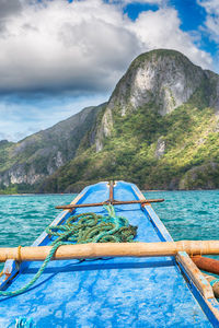 Scenic view of sea and mountains against sky