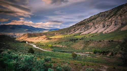 Scenic view of mountains against dramatic sky