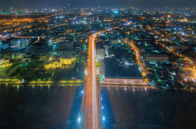 High angle view of illuminated city buildings at night