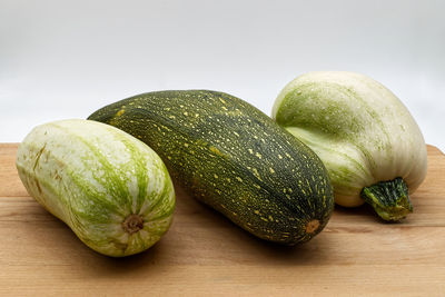 Close-up of fruits on table against white background