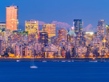 Illuminated buildings in city at night