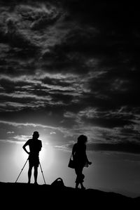 Silhouette of people at sunset
