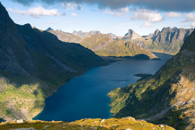 Steep mountains of lofoten island on a sunny arctic day. view from trail to hermannsdalstinden peak