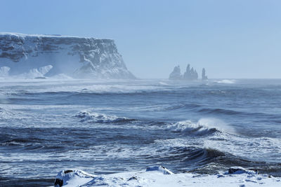 Wide lens capture of three pinnacles of vik, south iceland in wintertime