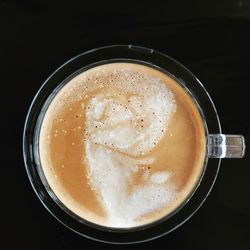 High angle view of cappuccino on table