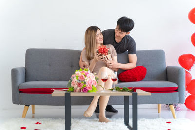 Young couple sitting on sofa