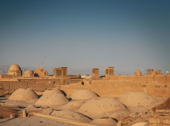 Old buildings against clear sky