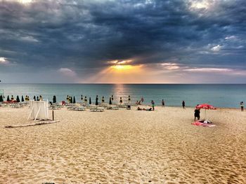 Scenic view of beach against sky during sunset