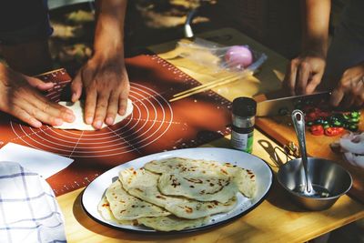 High angle view of man preparing food on table