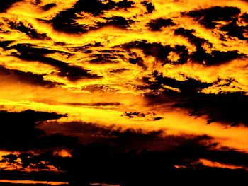 Low angle view of dramatic sky during sunset