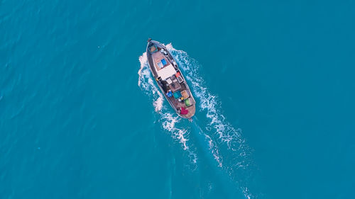 High angle view of people swimming in sea