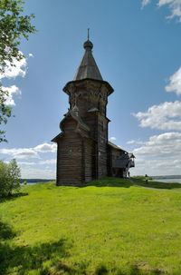 Church on field against sky