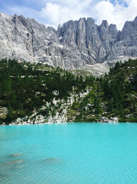 Scenic view of land and mountains against sky