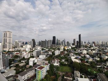 High angle view of modern buildings in city against sky