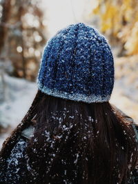 Rear view of woman wearing hat during winter