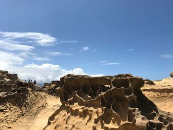 Rock formations in desert against sky