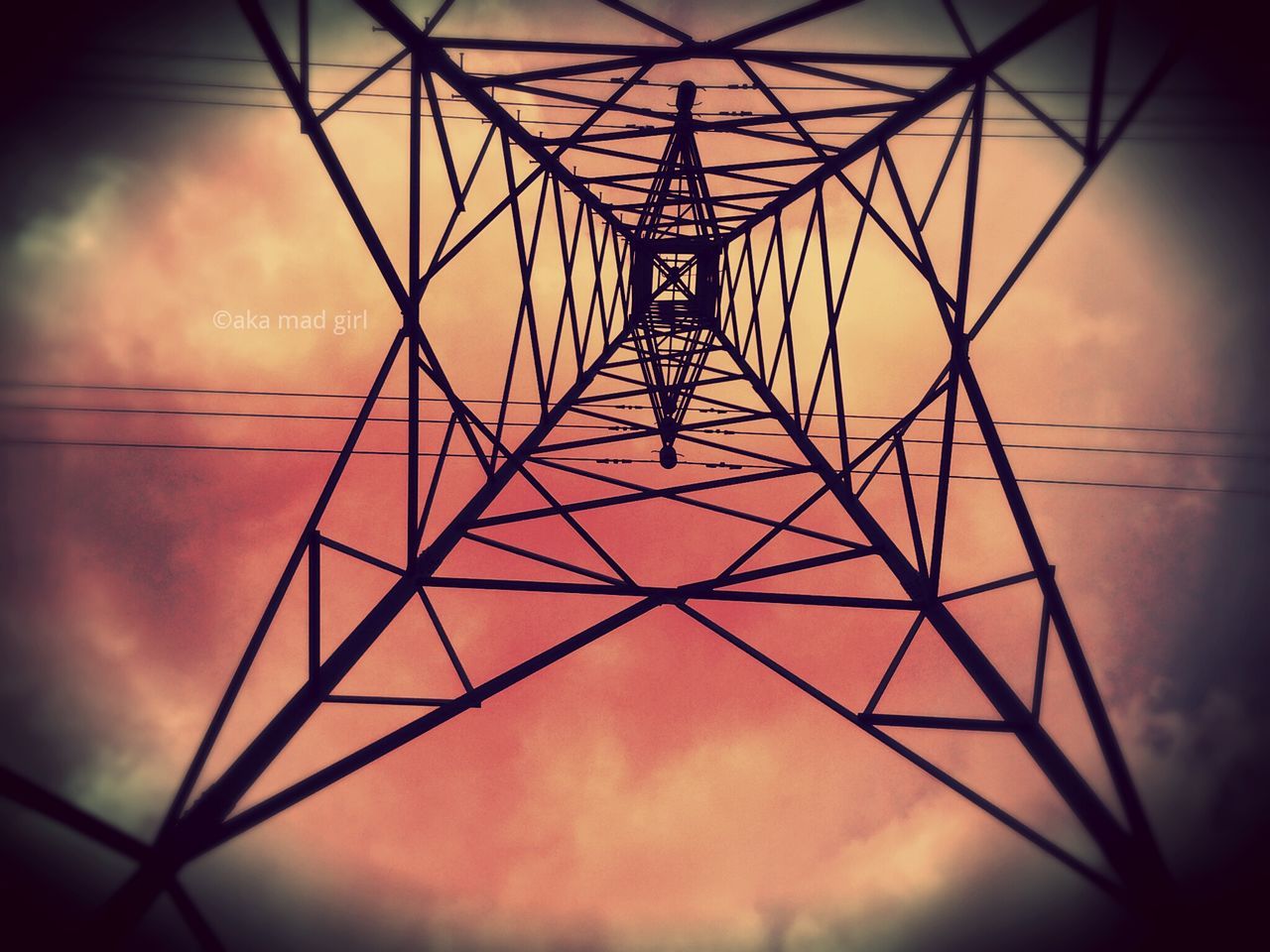 low angle view, power line, sky, electricity, power supply, electricity pylon, connection, silhouette, cable, sunset, cloud - sky, technology, fuel and power generation, built structure, no people, dusk, indoors, metal, complexity, architecture