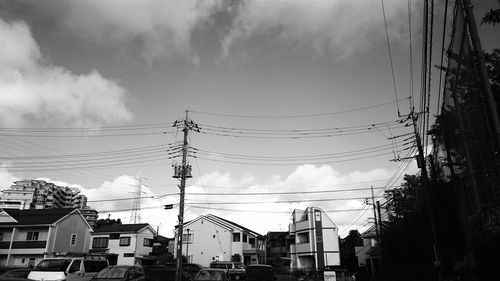 Low angle view of building against cloudy sky