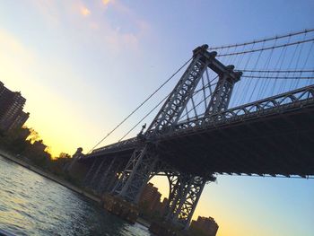 Low angle view of built structure against sky at sunset