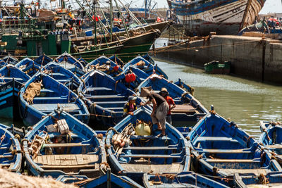 Boats moored at harbor