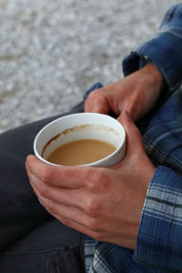 Woman holding coffee cup