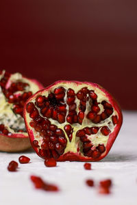 Close-up of pomegranate against black background