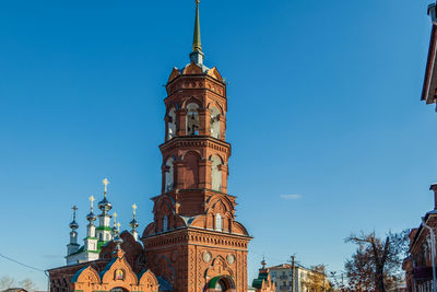 Low angle view of building against blue sky