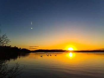 Scenic view of sunset over river