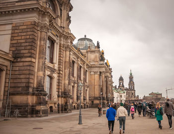 Group of people in front of historical building