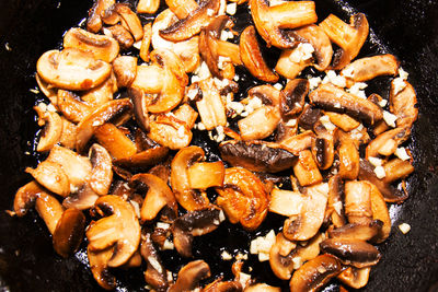 Roasted mushrooms in a frying pan. close up