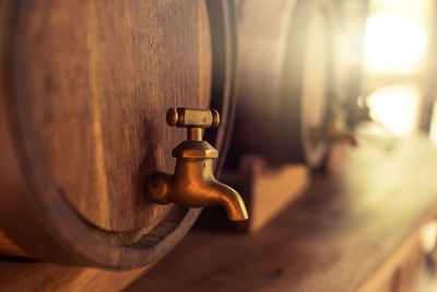 Close-up of faucet in barrel