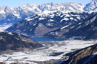 Aerial view of far zell am see lake among winter alp mountains in austria