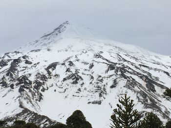 Scenic view of snow covered mountain against sky