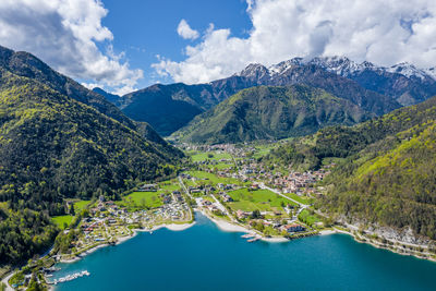 Scenic view of river amidst mountains against sky