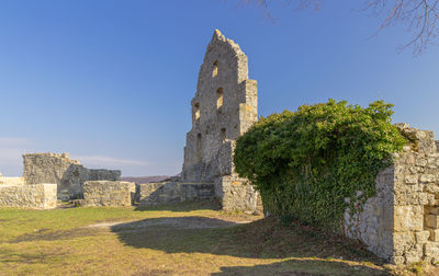 Old ruin building against blue sky