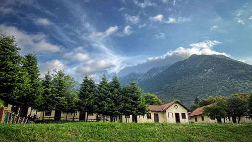 Houses and buildings against sky