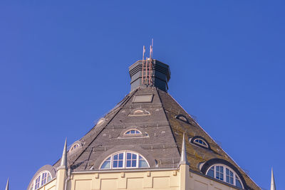Low angle view of building against blue sky