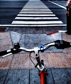 High angle view of bicycle parked on road