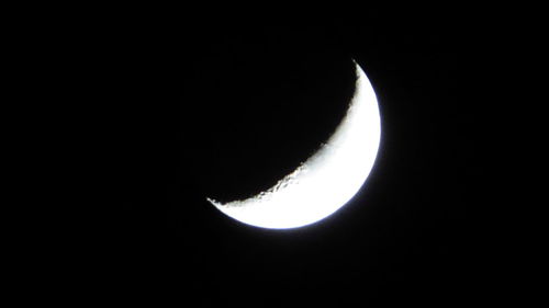 Low angle view of moon against sky at night