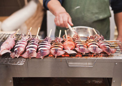 Close-up of preparing food on grill